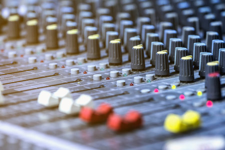 Mixer level control knob in the control room and sound recorder.