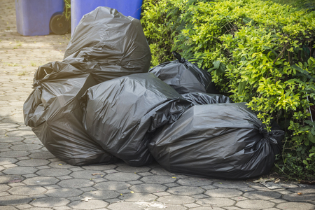 Waste in black bags waiting to be stored.の写真素材
