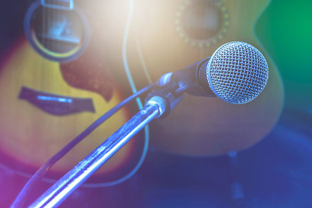 Retro guitar and microphone in the control room.の写真素材