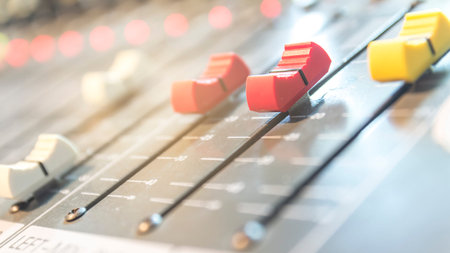 Slide the audio mixer in the control room.
