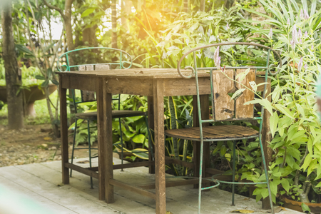 Classic wooden table and chairs for relaxing in the garden at home.の写真素材