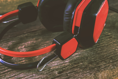 Red earphones with very old wood.の写真素材