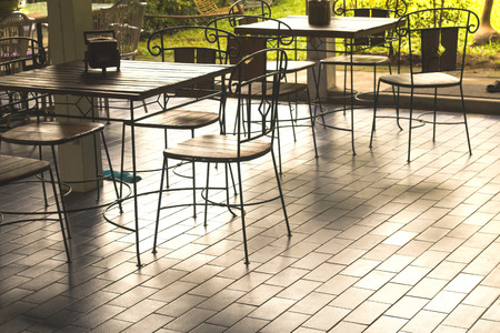 Classic wooden tables and chairs for dining.の写真素材