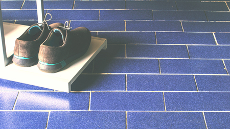 cool film with vintage style shoes on the shelves in the houseの写真素材