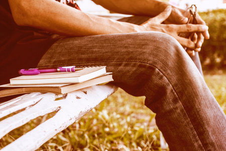 Diary of memories. Notebook and pen on steel benches in the park.の写真素材
