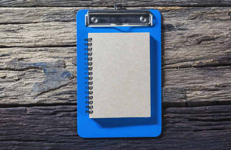 Brown diary book on old wood.の写真素材