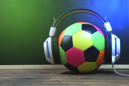 Modern Headphones and football, Music and sports equipment concept.の写真素材