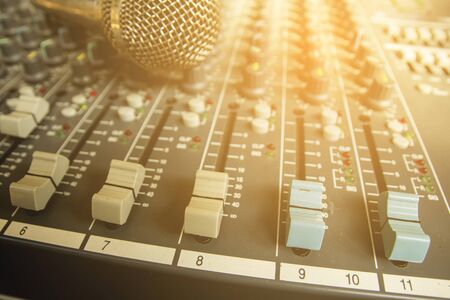 Slide the volume control of the audio mixer.の写真素材