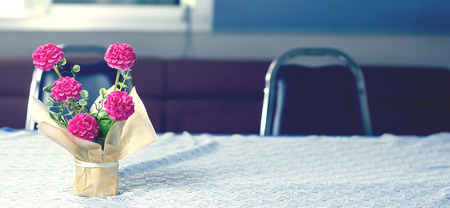 Flowers on the table in the library.の写真素材