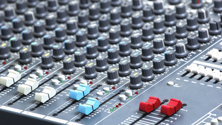 Slide the volume control of the audio mixer.の写真素材