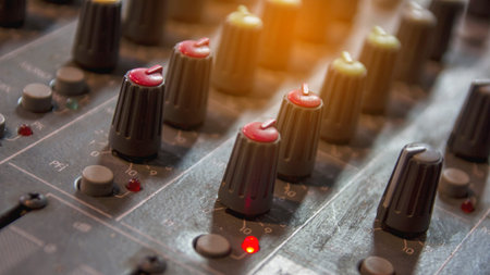Mixer console and volume buttons.