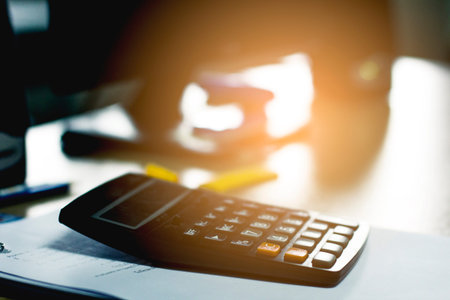 Calculator on the desk in the office. Vintage style.の写真素材