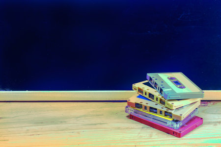 Vintage style audio cassette tapes background blackboard.