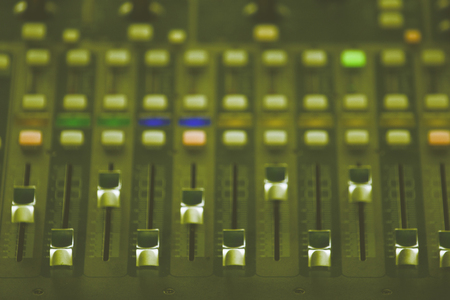 Slide the audio mixer in the control room.の写真素材