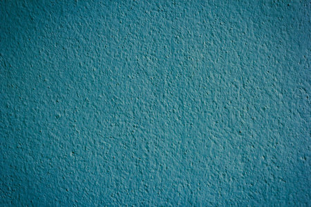 The texture and detail of green cement wall.