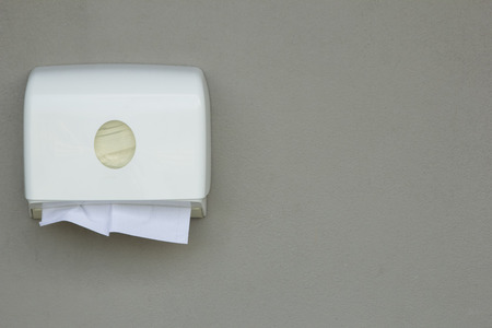 Toilet paper box on gray wall.の写真素材