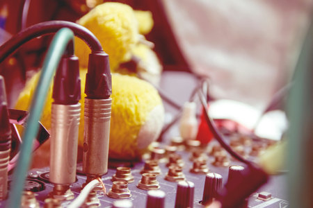 Signal jack from the audio mixer in the home studio. Photo filter.