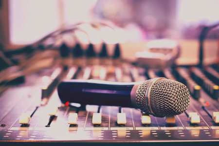 Wireless microphone on the audio mixer in the control room of the company.の写真素材