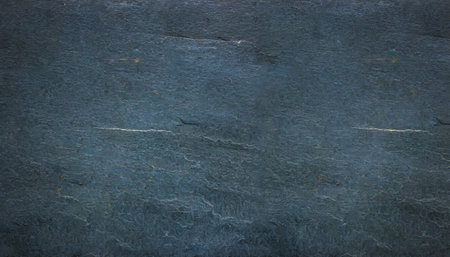 The background has a rough, dark gray stone surface.の素材