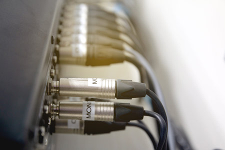 Phone jack and cable to digital audio mixer in conference room control room.の写真素材