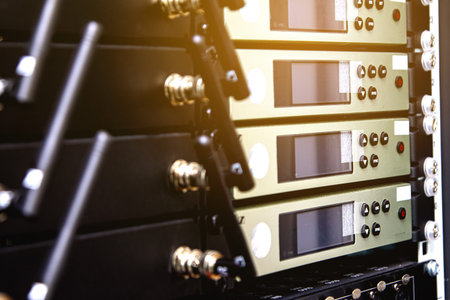 Rack cabinet includes wireless microphone receiver in the control room.