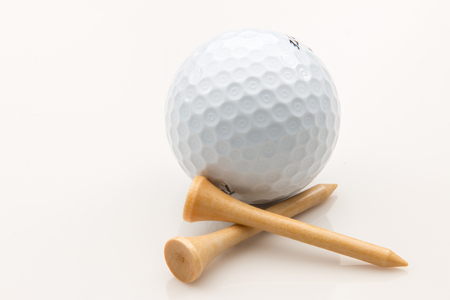 Golf Ball and golf tees on a white background.の写真素材