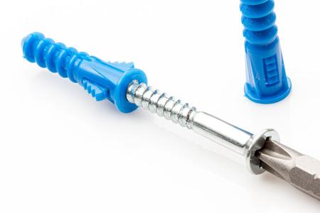 Hollow wall anchors and screw on white background.の写真素材