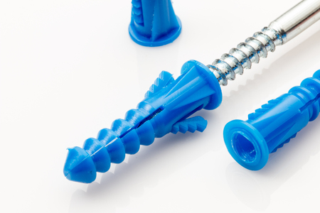 Hollow wall anchors and screw on white background.の写真素材
