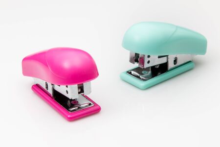 Two Staplers in small size on white background.の写真素材