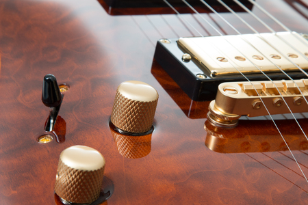 Electric guitar close up with gold pickups.の写真素材