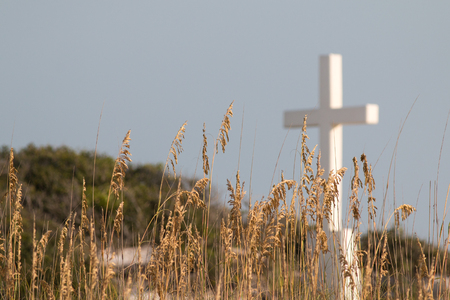 White cross on a sand dune.の写真素材