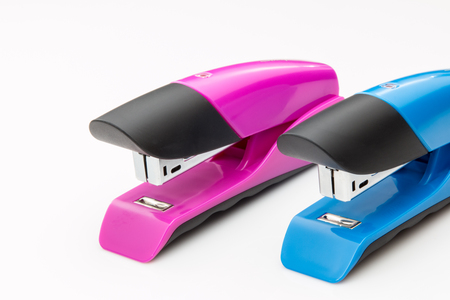 Two staplers on a white background.の写真素材