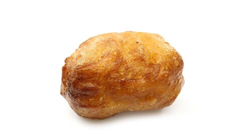 freshly baked traditional dutch oliebol on a white background の写真素材