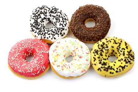 assorted colorful glazed donuts with sprinkles on a white background の写真素材