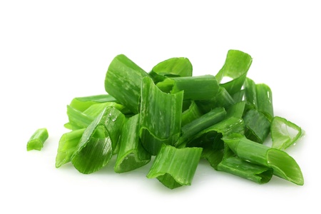 cut green onions on a white backgroundの写真素材