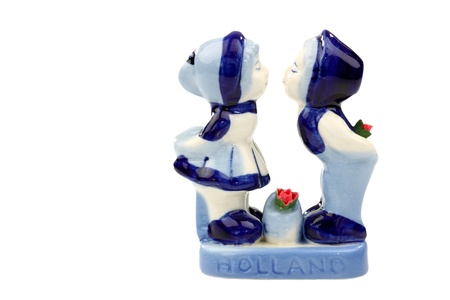 two kissing ceramic figurines from Holland on a white background の写真素材
