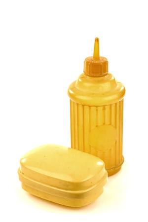 old plastic spraying bottle and soap box on a white background の写真素材