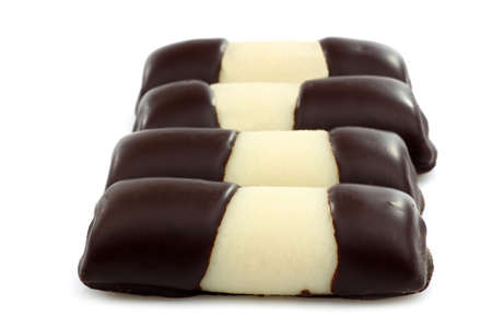 sweet marzipan chocolate rolls on a white background の写真素材