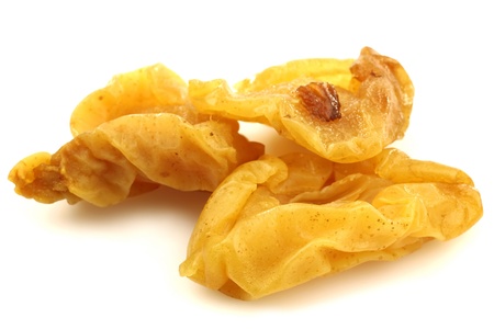 dried pear halves on a white background の写真素材