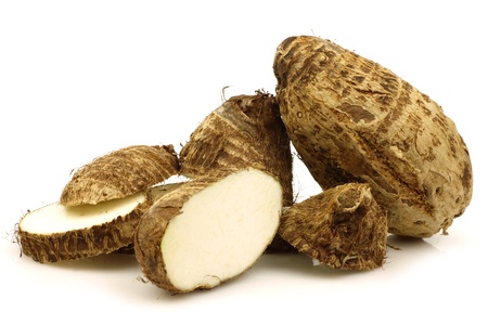 two cut fresh taro root  colocasia  on a white background の写真素材