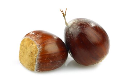 two fresh chestnuts on a white background の写真素材