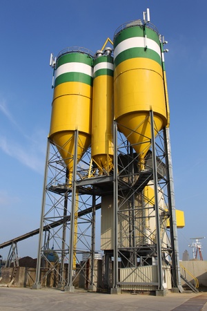cement factory against blue sky の写真素材