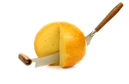pieces of Dutch Edam cheese with a cheese cutter on a white background の写真素材