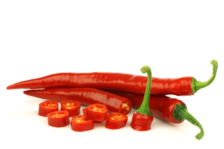 red chili peppers  Capsicum  and a cut one on a white background の写真素材