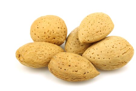 bunch of almond nuts on a white background の写真素材