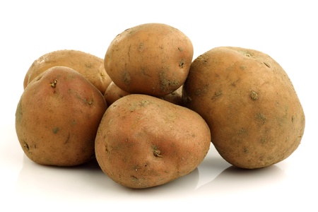 bunch of potatoes on a white background の写真素材