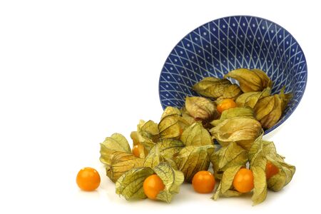 a decorated bowl with physalis fruit  Physalis peruviana  on a white background の写真素材
