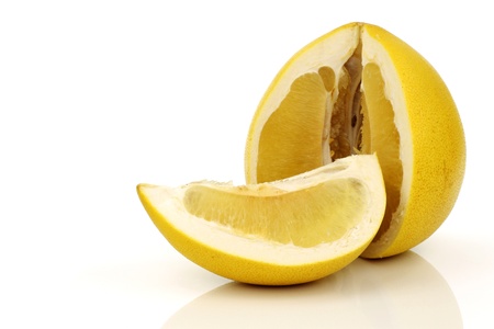 a cut pomelo fruit on a white background の写真素材