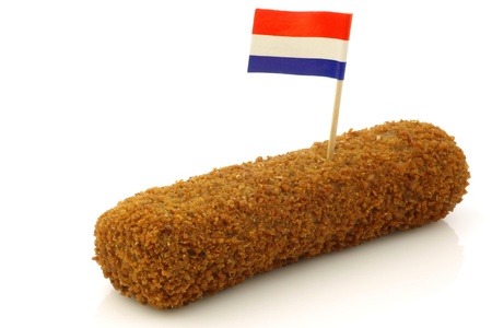 a Dutch snack called  kroket  with a Dutch flag toothpick on a white background の写真素材
