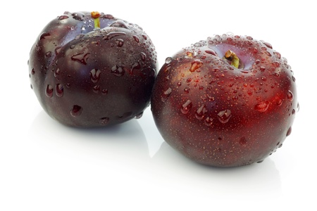 two fresh plums on a white background の写真素材